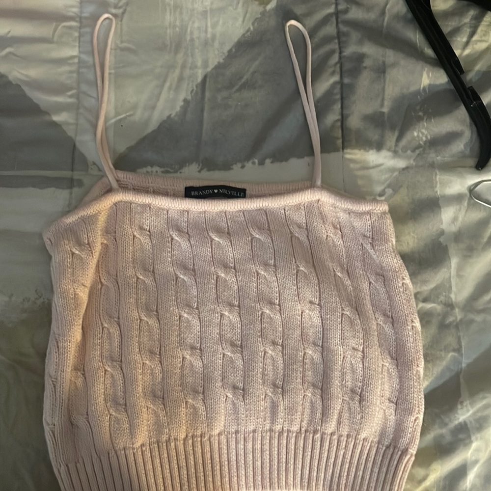 Its a pink tank top with thin straps and baby pink.